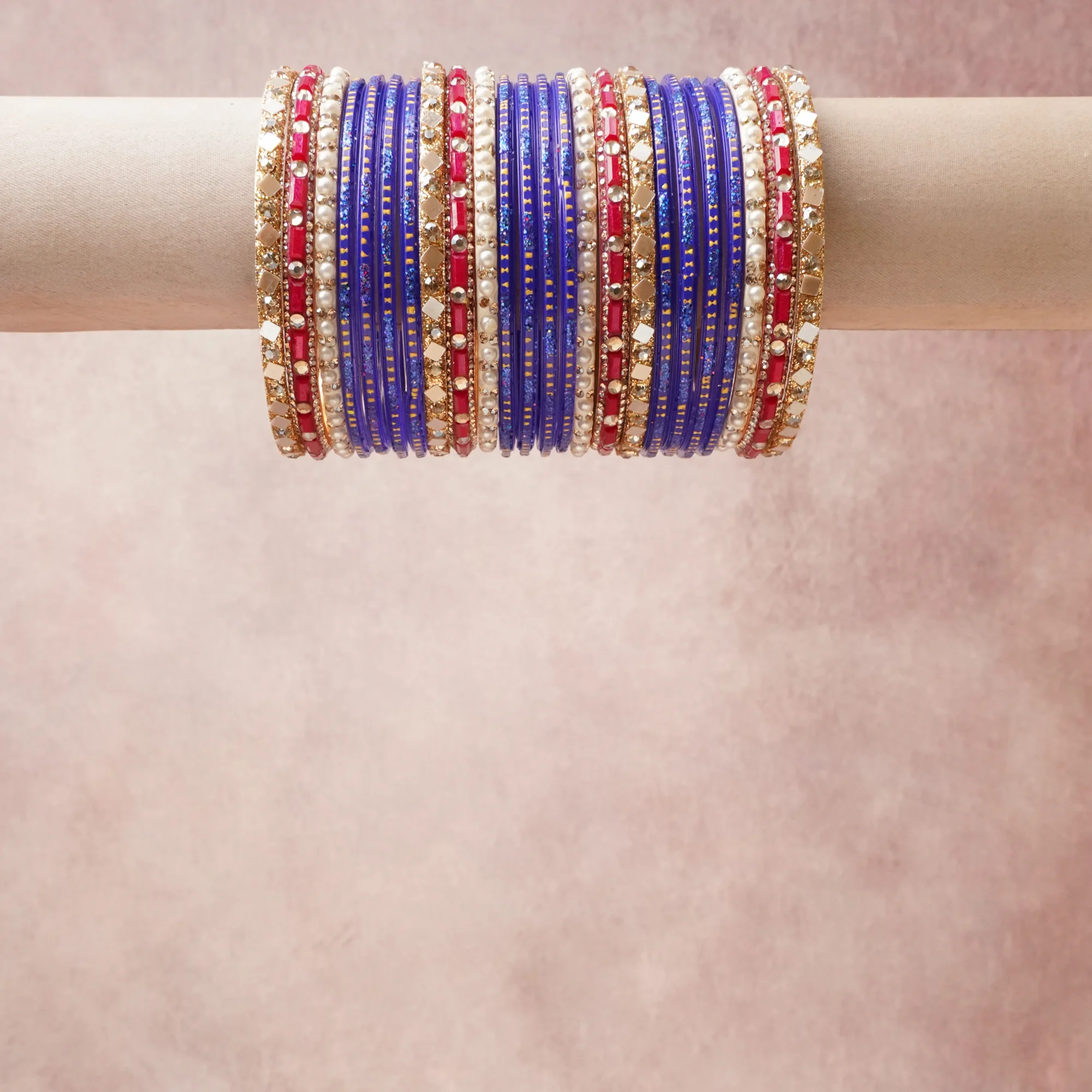 A grounding Deep Sapphire Blue forms the heart of the set, while touches of Crimson Red, Ivory, Rich Gold add charm.

A thoughtful composition of Glass, Faux Pearls, Base Metal (Gold-plated), Mirror, Crystal/Rhinestone, Glitter, designed to feel complete without being heavy.
Each element layers seamlessly, creating a look that is refined, wearable and quietly striking.